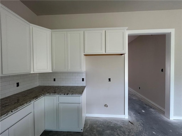 2814 Messenger Way, Bryan, TX 77802 - kitchen featuring unfinished concrete flooring, white cabinetry, backsplash, and stone countertops