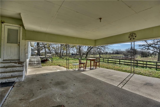 view of patio with a rural view