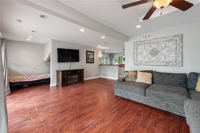 living room featuring ceiling fan and wood-type flooring