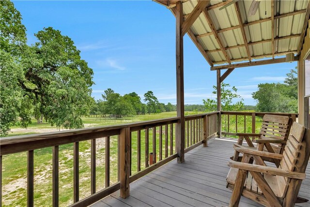 15184 Fm 2620, Bedias, TX 77831 - wooden terrace with a yard and view of wooded area