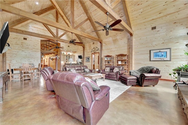 15184 Fm 2620, Bedias, TX 77831 - living area with concrete floors, high vaulted ceiling, ceiling fan, and a wood ceiling with exposed beams