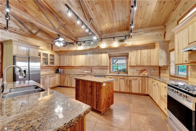 15184 Fm 2620, Bedias, TX 77831 - kitchen featuring rail lighting, light brown cabinets, stainless steel appliances, wood ceiling, and a center island