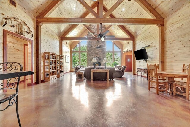 15184 Fm 2620, Bedias, TX 77831 - dining area featuring high vaulted ceiling, a ceiling fan, a wood ceiling with exposed beams, and finished concrete flooring
