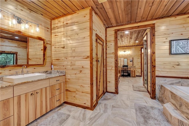 15184 Fm 2620, Bedias, TX 77831 - full bathroom featuring wooden walls, wooden ceiling, vanity, and a tub with marble appearance