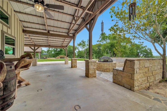 15184 Fm 2620, Bedias, TX 77831 - view of patio featuring a ceiling fan and an outdoor fire pit