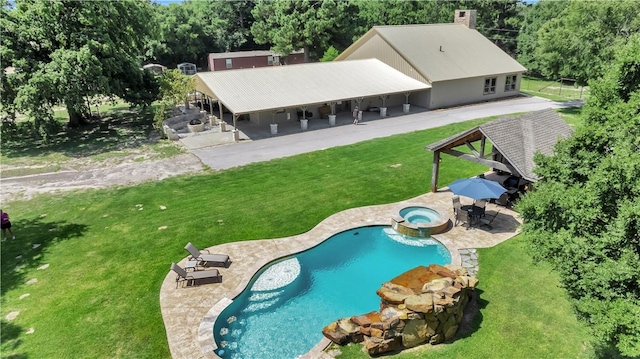 15184 Fm 2620, Bedias, TX 77831 - view of swimming pool with a yard, a patio, a pool with connected hot tub, and view of wooded area