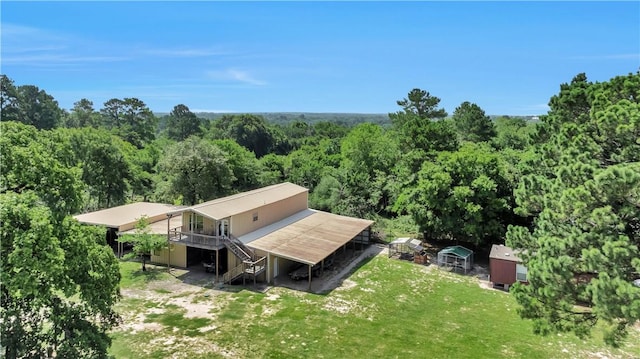 15184 Fm 2620, Bedias, TX 77831 - aerial view of property and surrounding area featuring a heavily wooded area