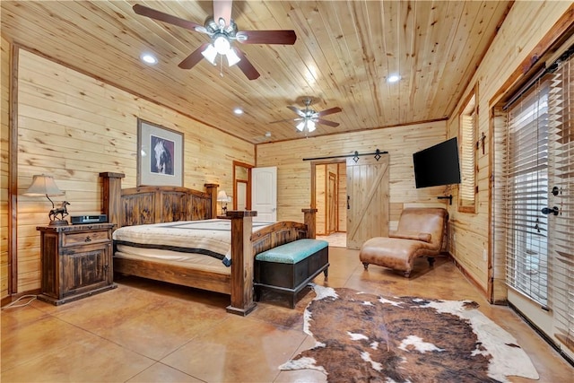 15184 Fm 2620, Bedias, TX 77831 - bedroom with wood walls, a barn door, recessed lighting, wood ceiling, and finished concrete flooring
