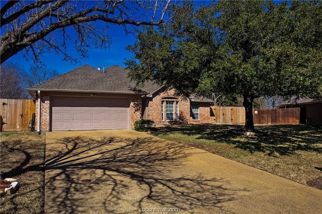 ranch-style home with a garage and a front lawn