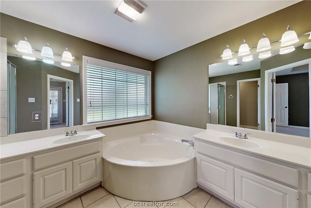 bathroom featuring tile patterned floors, vanity, and plus walk in shower