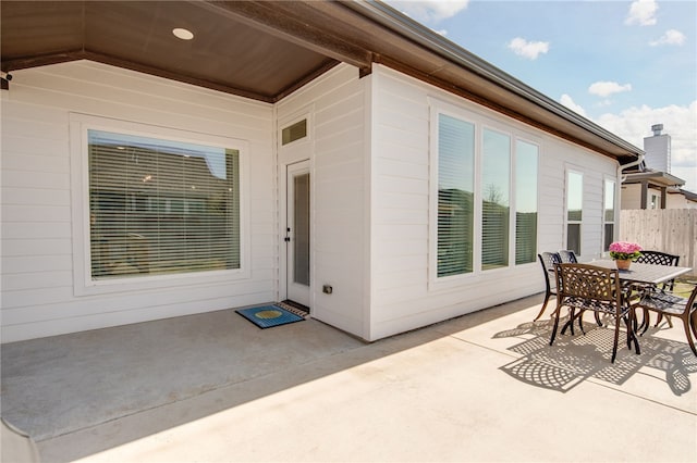 view of patio / terrace featuring fence and outdoor dining space