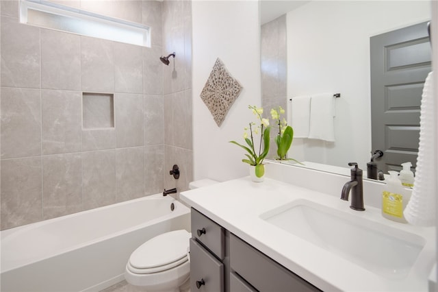 bathroom with toilet, shower / bathtub combination, and vanity