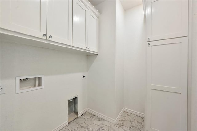 washroom featuring cabinets, hookup for an electric dryer, and hookup for a washing machine