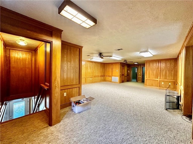 interior space featuring a textured ceiling and light carpet