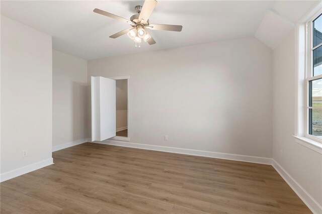 3223 Tamy Ln, Brenham, TX 77833 - unfurnished room featuring light wood-style flooring, baseboards, vaulted ceiling, and a ceiling fan