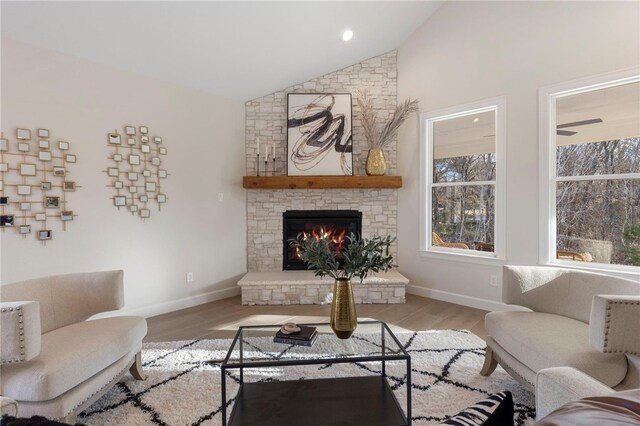 3223 Tamy Ln, Brenham, TX 77833 - living room with wood finished floors, a fireplace, baseboards, and high vaulted ceiling