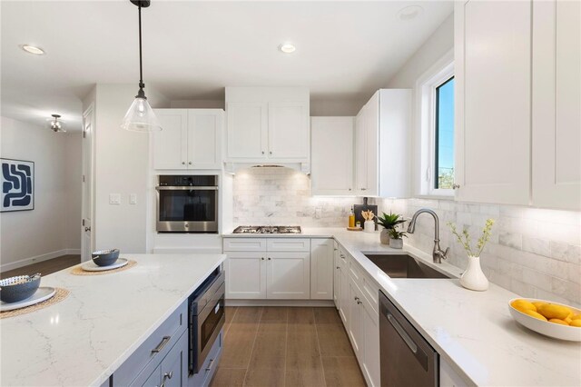 3223 Tamy Ln, Brenham, TX 77833 - kitchen with appliances with stainless steel finishes, a sink, white cabinetry, and recessed lighting