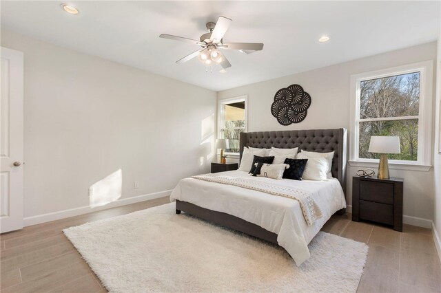 3223 Tamy Ln, Brenham, TX 77833 - bedroom with baseboards, light wood-type flooring, recessed lighting, and a ceiling fan