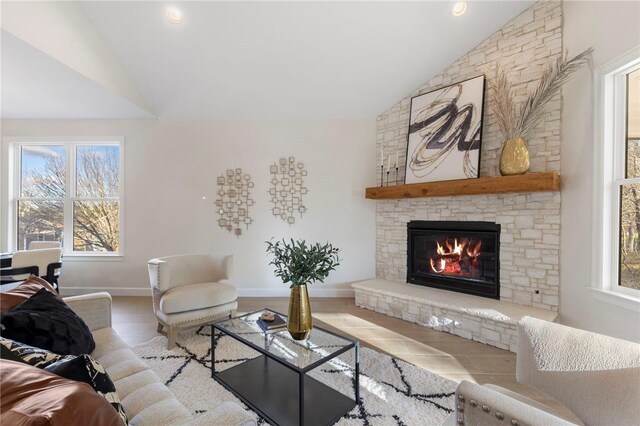 3223 Tamy Ln, Brenham, TX 77833 - living room with vaulted ceiling, a fireplace, wood finished floors, and baseboards
