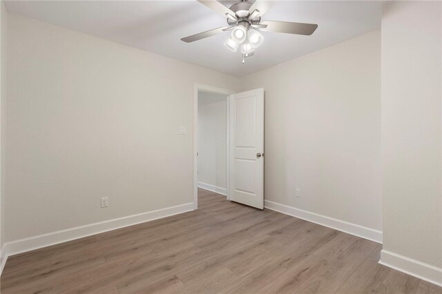 3223 Tamy Ln, Brenham, TX 77833 - empty room featuring light wood finished floors, baseboards, and ceiling fan