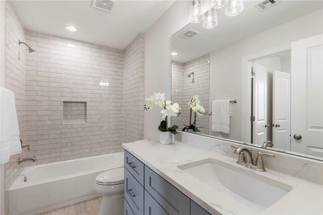 3223 Tamy Ln, Brenham, TX 77833 - bathroom featuring vanity, toilet, and bathtub / shower combination