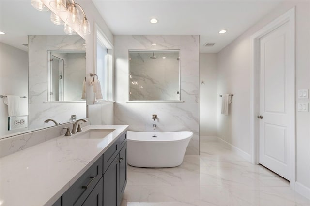 3223 Tamy Ln, Brenham, TX 77833 - full bath with vanity, a freestanding bath, marble tiled flooring, a marble finish shower, and recessed lighting