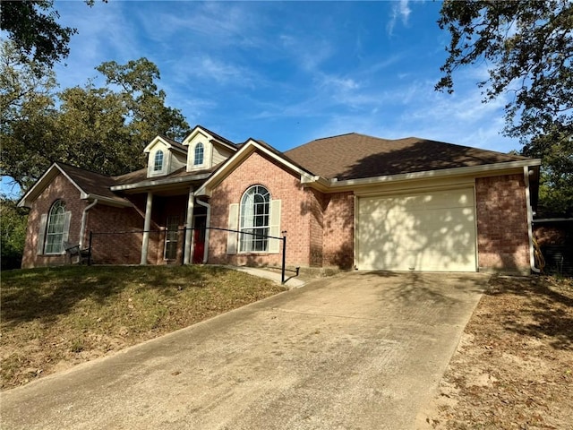 view of front facade with a front yard and a garage