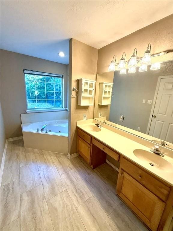 bathroom featuring a bathtub, vanity, and wood-type flooring