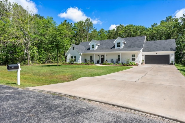 8729 Nathan Dr, Waller, TX 77484 - cape cod home featuring a garage, a front lawn, driveway, and a shingled roof