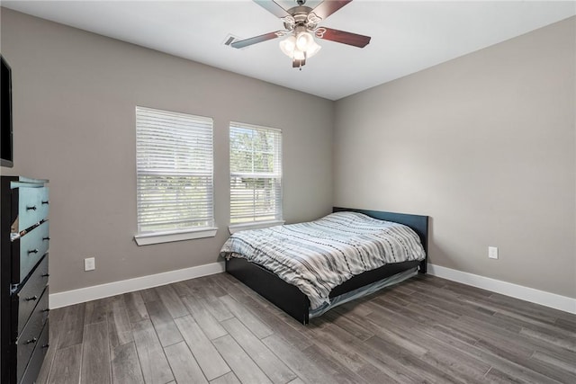 8729 Nathan Dr, Waller, TX 77484 - bedroom with wood finished floors and a ceiling fan