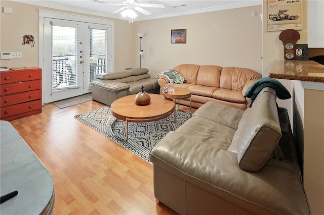 living room with crown molding, light hardwood / wood-style floors, french doors, and ceiling fan