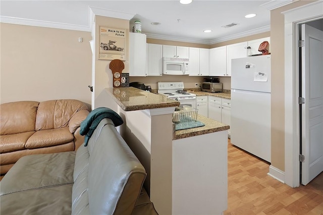 kitchen with crown molding, white appliances, white cabinets, stone countertops, and kitchen peninsula