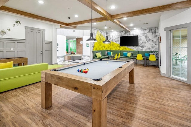 game room with billiards, beam ceiling, and light hardwood / wood-style floors