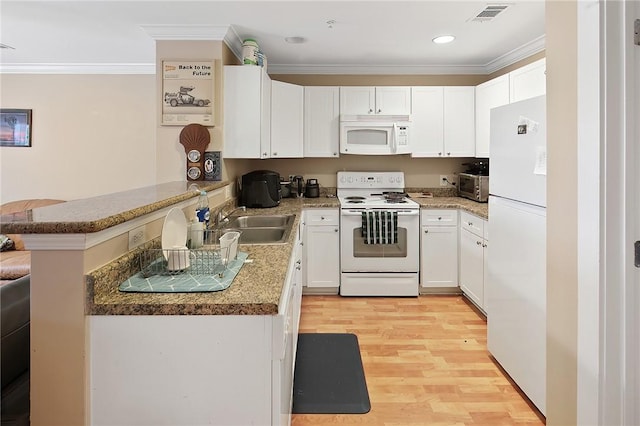 kitchen featuring ornamental molding, white cabinets, white appliances, and kitchen peninsula