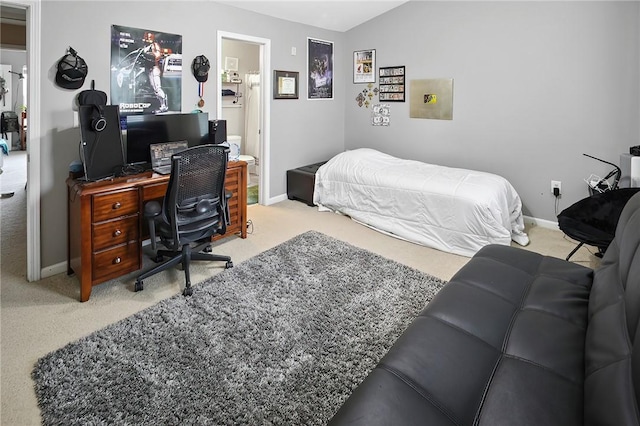 bedroom featuring vaulted ceiling and carpet floors