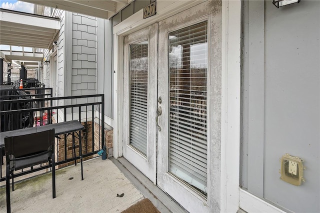 balcony featuring french doors