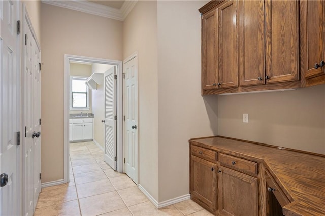 904 Plainfield Ct, College Station, TX 77845 - corridor with crown molding, light tile patterned floors, and baseboards