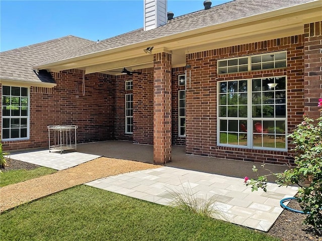 view of patio featuring ceiling fan