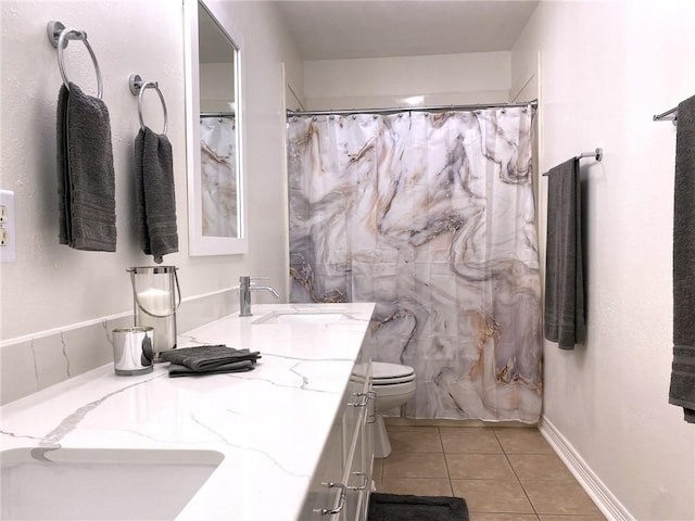 bathroom with tile patterned flooring, vanity, curtained shower, and toilet