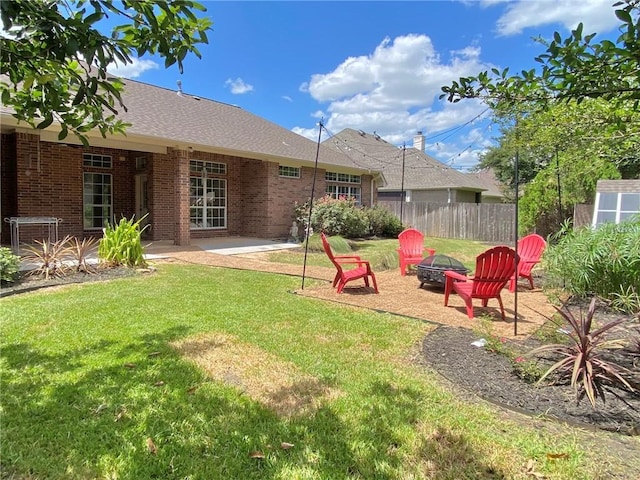 view of yard with an outdoor fire pit and a patio area