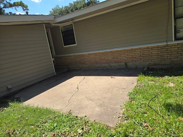 view of home's exterior with a patio