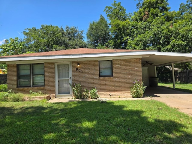 ranch-style house with a front lawn and a carport