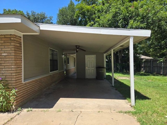 view of vehicle parking featuring a yard and a carport