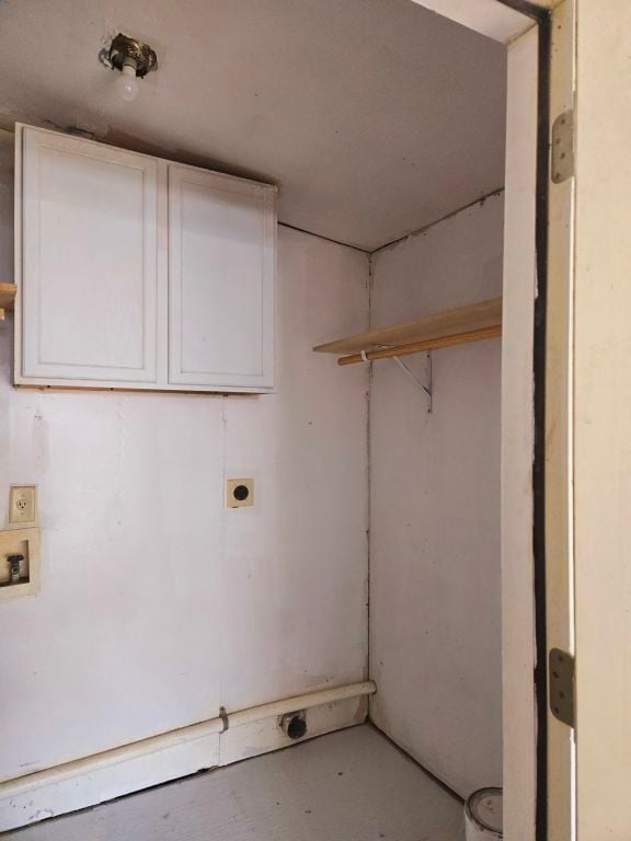 washroom with hookup for a washing machine, cabinets, and hookup for an electric dryer