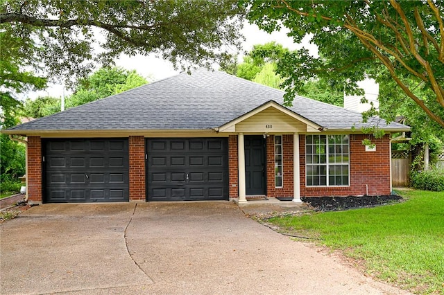 400 Princeton Cir, College Station, TX 77840 - single story home with driveway, a chimney, a garage, brick siding, and a shingled roof
