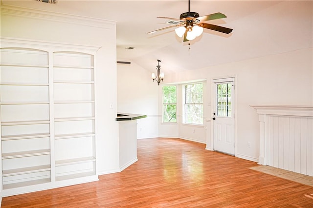 400 Princeton Cir, College Station, TX 77840 - unfurnished living room featuring a chandelier, light wood finished floors, a ceiling fan, and lofted ceiling