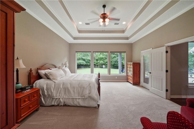 bedroom featuring light carpet, access to exterior, ornamental molding, a tray ceiling, and ceiling fan