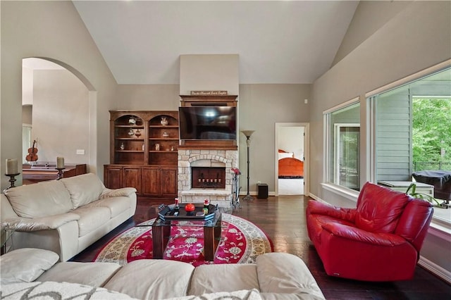 living room featuring a fireplace, high vaulted ceiling, and dark wood-type flooring