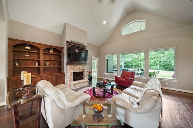 living room featuring a stone fireplace, high vaulted ceiling, and dark hardwood / wood-style floors