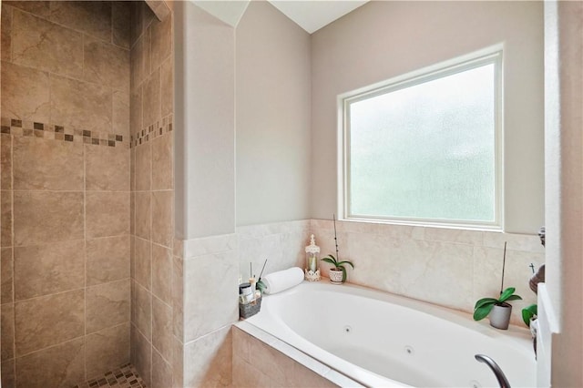 bathroom featuring separate shower and tub and a healthy amount of sunlight